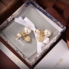 Dior pearl lock and star earings