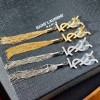 YSL long earings gold/ silver