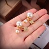 Dior pearl lock and star earings