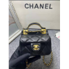 Chanel handle flap bag gold