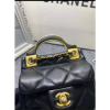 Chanel handle flap bag gold