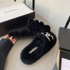 Chanel black shearling slippers