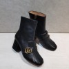 Gucci black GG boots