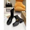 Burberry black patent leather boots