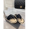 Chanel slippers in raffia