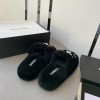 Chanel black shearling slippers