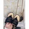 Chanel slippers in raffia