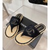 Chanel slippers in raffia