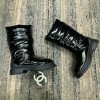 Chanel black patent boots