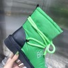 Balenciaga green puffer boots