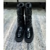 Chanel black patent boots