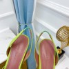 Amina Muaddi green heels