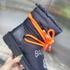 Balenciaga orange puffer boots