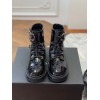 Chanel black patent CC boots