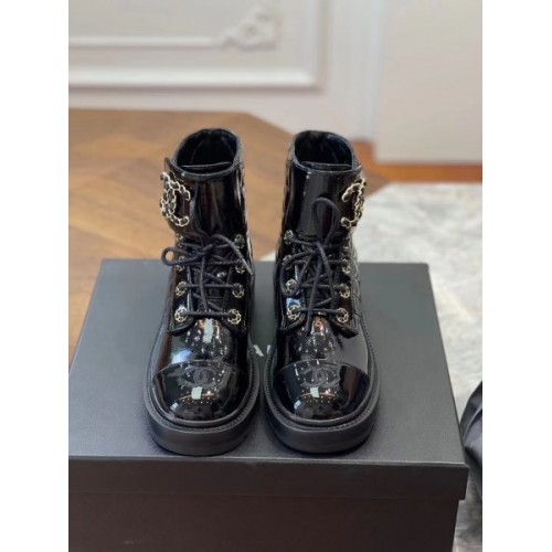 Chanel black patent CC boots